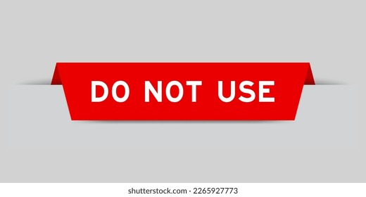 Red color inserted label with word do not use on gray background