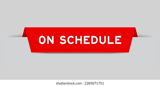 Red color inserted label with word on schedule on gray background