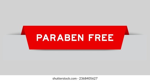 Red color inserted label with word paraben free on gray background