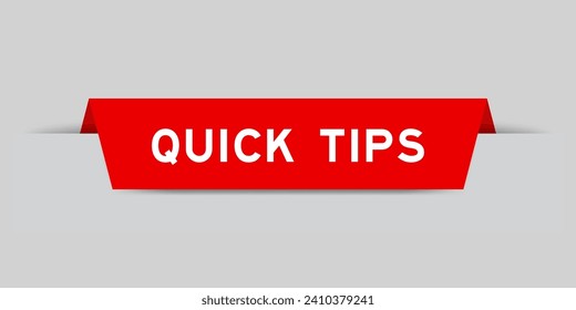 Red color inserted label with word quick tips on gray background