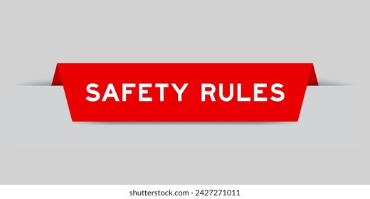 Red color inserted label with word safety rules on gray background