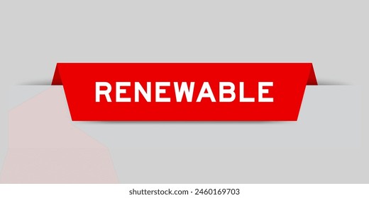 Red color inserted label with word renewable on gray background