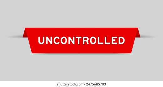 Red color inserted label with word uncontrolled on gray background