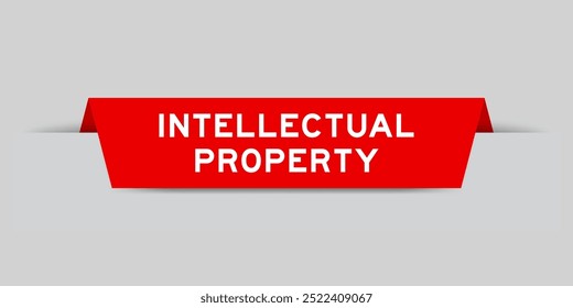 Red color inserted label with word intellectual property on gray background