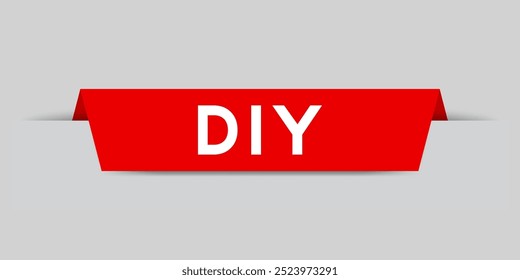 Red color inserted label with word DIY (abbreviation of do it yourself) on gray background