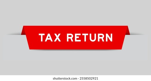 Red color inserted label with word tax return on gray background