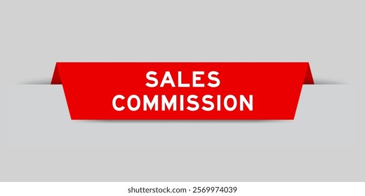 Red color inserted label with word sales commission on gray background