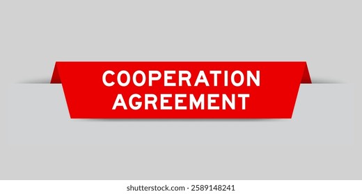 Red color inserted label with word cooperation agreement on gray background