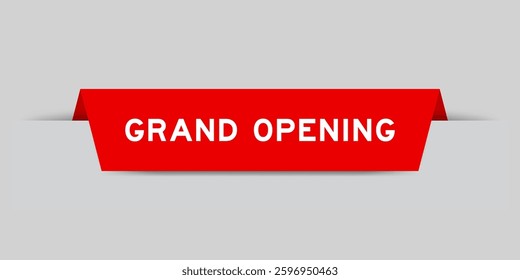 Red color inserted label with word grand opening on gray background