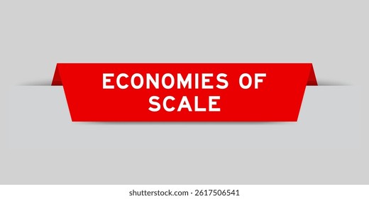 Red color inserted label with word economies of scale on gray background