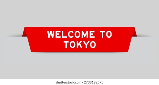 Red color inserted label with word welcome to tokyo on gray background