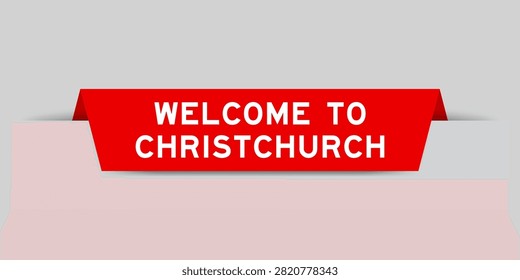 Red color inserted label with word welcome to christchurch on gray background