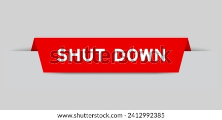 Red color inserted label with word shut down on gray background