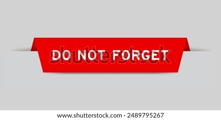 Red color inserted label with word do not forget on gray background