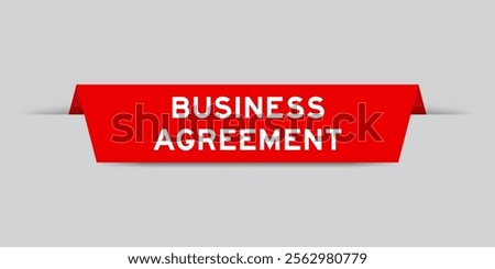 Red color inserted label with word business agreement on gray background