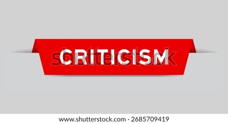 Red color inserted label with word criticism on gray background