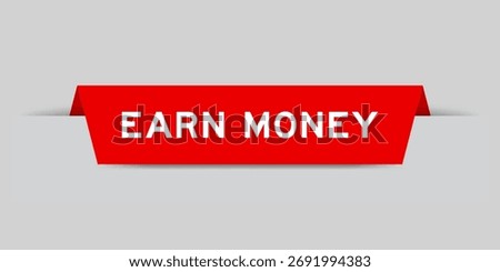 Red color inserted label with word earn money on gray background