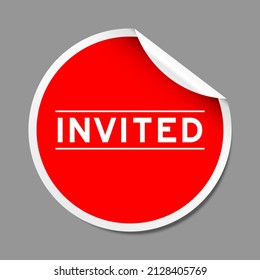 Red color peel sticker label with word invited on gray background