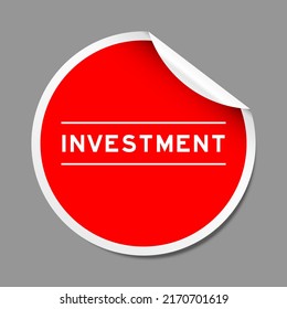 Red color peel sticker label with word investment on gray background