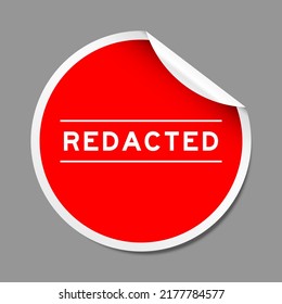 Red color peel sticker label with word redacted on gray background