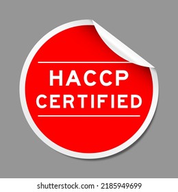 Red color peel sticker label with word HACCP (Hazard Analysis Critical Control Points) certified on gray background