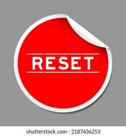 Red color peel sticker label with word reset on gray background