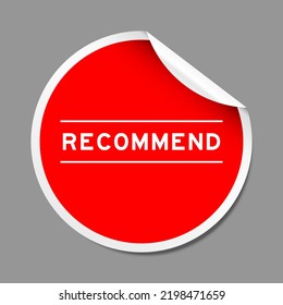 Red color peel sticker label with word recommend on gray background