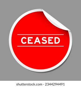 Red color peel sticker label with word ceased on gray background