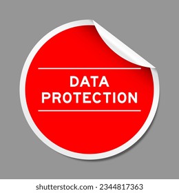 Red color peel sticker label with word data protection on gray background