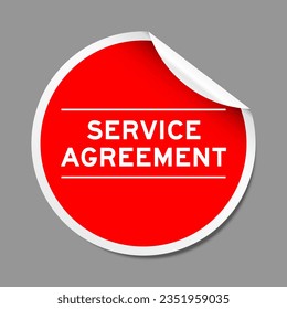 Red color peel sticker label with word service agreement on gray background