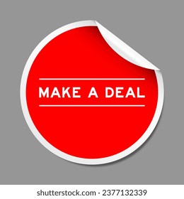 Red color peel sticker label with word make a deal on gray background