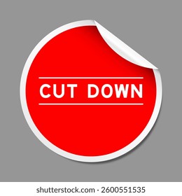 Red color peel sticker label with word cut down on gray background