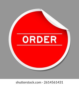 Red color peel sticker label with word order on gray background