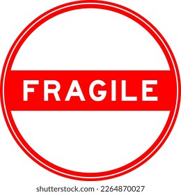 Red color round seal sticker in word fragile on white background