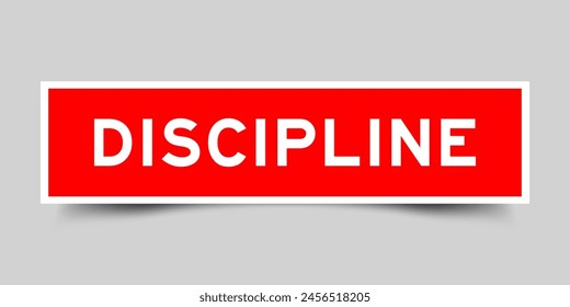 Red color square label sticker with word discipline that inserted in gray background