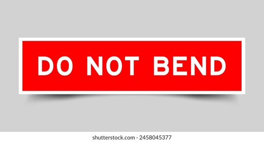 Red color square label sticker with word do not bend that inserted in gray background