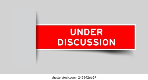 Red color square label sticker with word under discussion that inserted in gray background