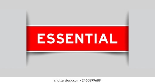 Red color square label sticker with word essential that inserted in gray background