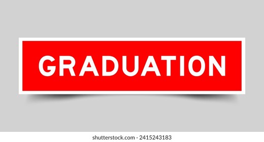 Red color square shape sticker label with word graduation on gray background