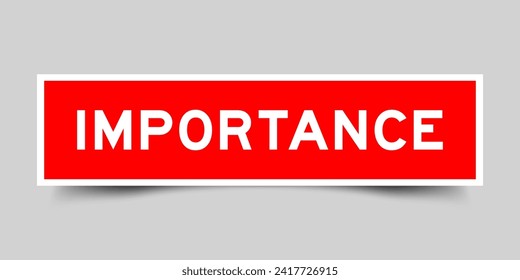 Red color square shape sticker label with word importance on gray background