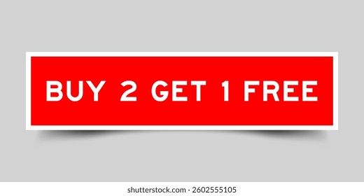 Red color square shape sticker label with word buy 2 get 1 free on gray background