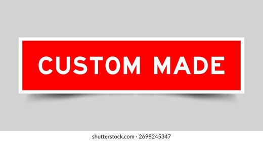 Red color square shape sticker label with word custom made on gray background