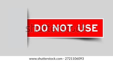 Red color square shape sticker label with word do not use inserted in gray background