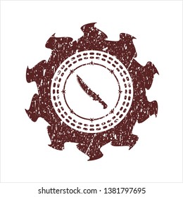 Red combat knife icon inside distressed rubber seal with grunge texture