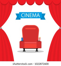 Red comfortable armchair in the cinema with drinks and popcorn. Red auditorium