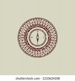 Red compass icon inside distress rubber seal