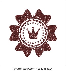 Red crown icon inside grunge stamp