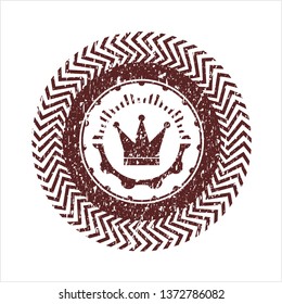 Red crown icon inside rubber grunge stamp