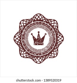 Red crown icon inside rubber stamp with grunge texture