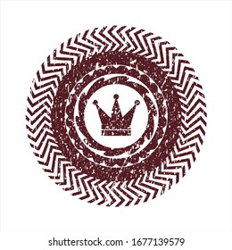 Icono de la corona roja dentro del sello de goma grunge